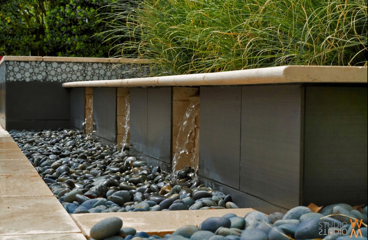 Steeplechase stone water feature with river rock