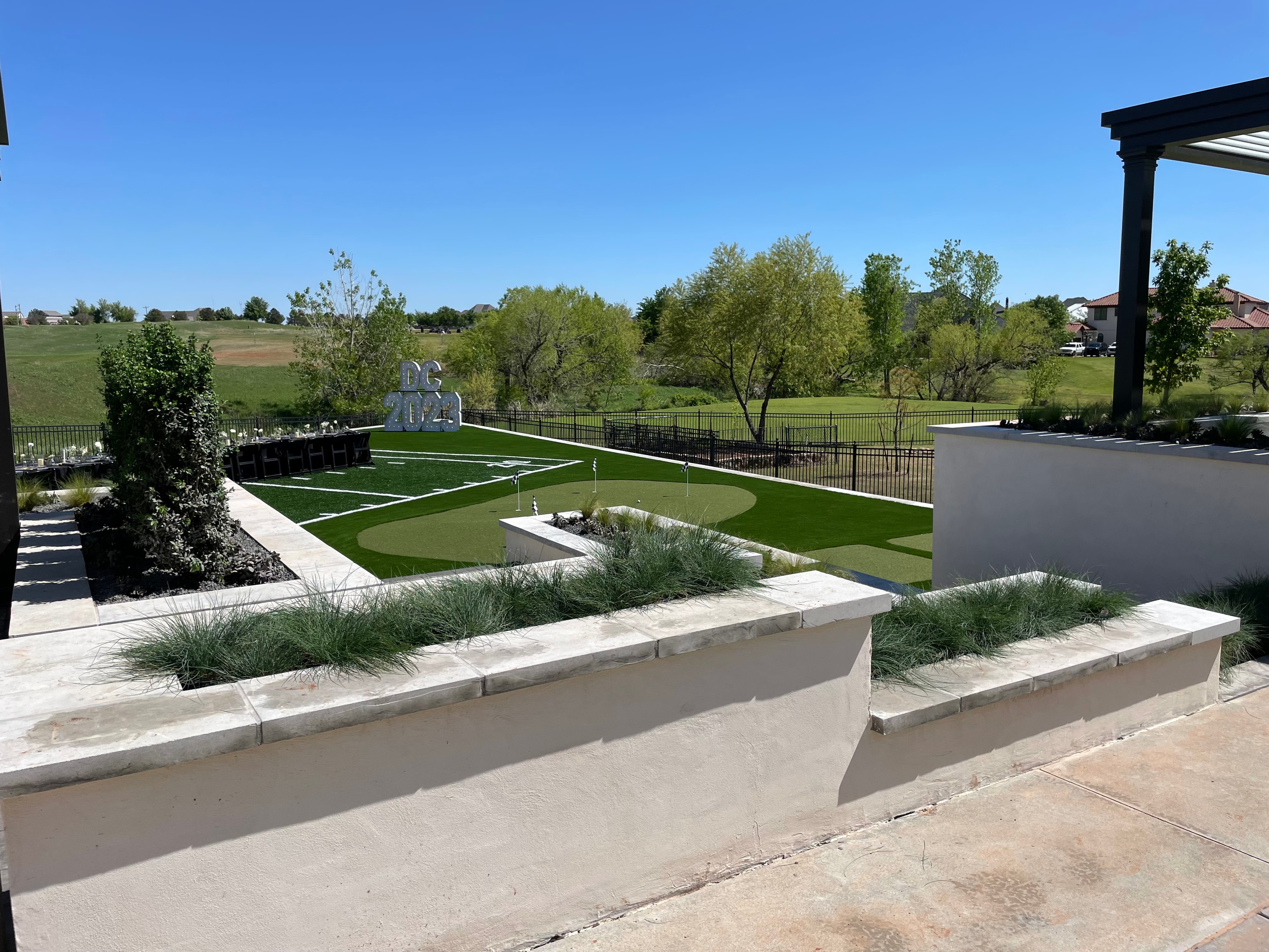 Completed DC 2023 putting green and sports turf with ornamental grass planters